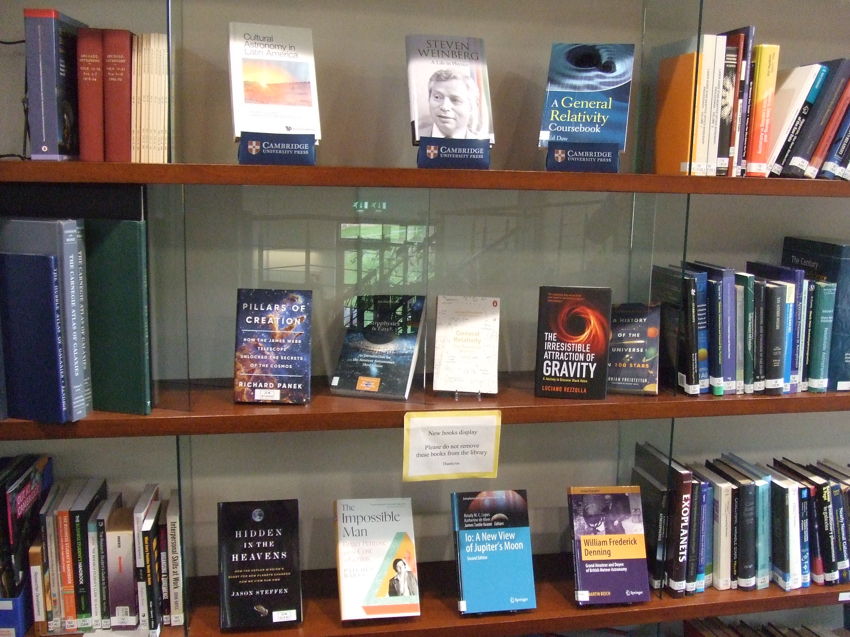 Three rows of books displayed